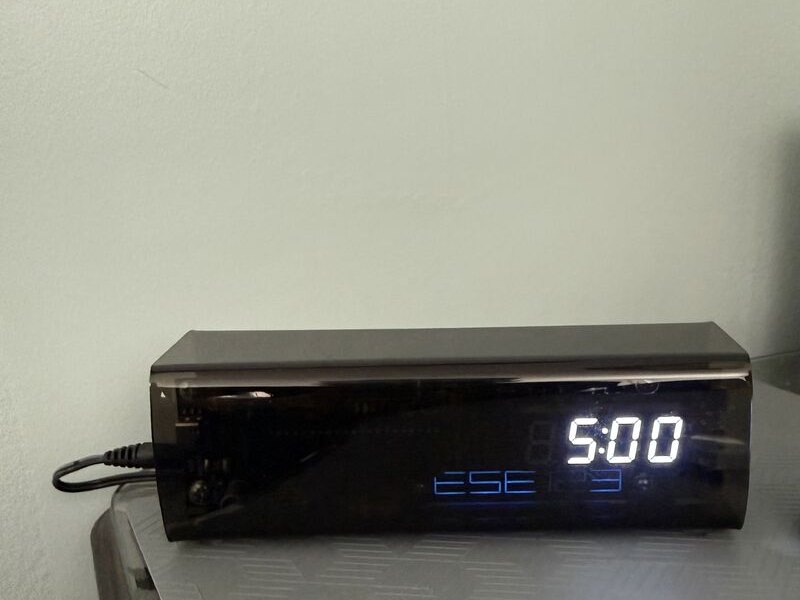 The finished clock in its enclosure, reading 5:00
