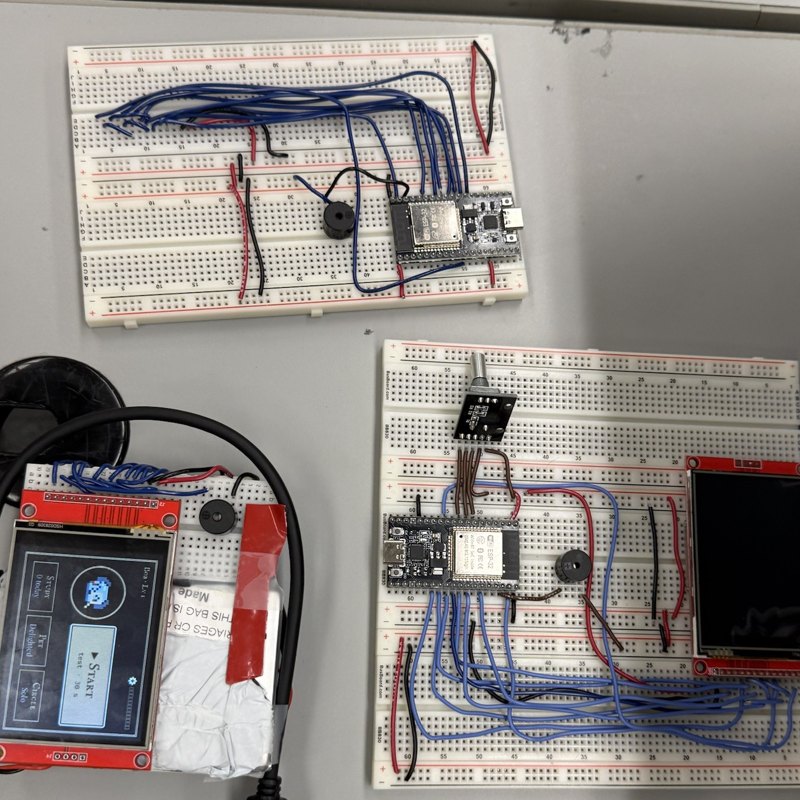 Three Pomo builds: two breadboard prototypes and the palm-sized battery build with its screen on