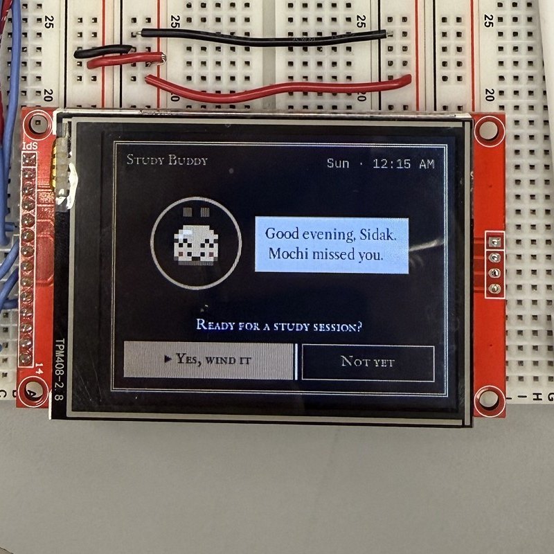 The device screen greeting: 'Good evening, Sidak. Mochi missed you.'